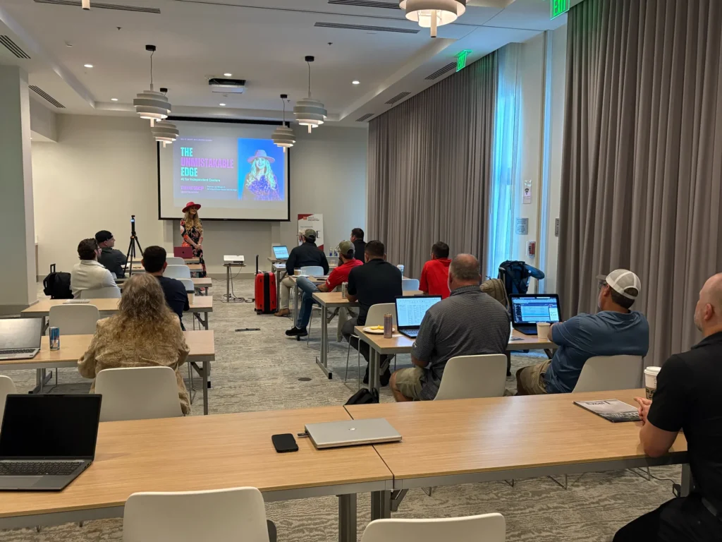 Attendees with laptops listen as Stefanie Couch presents The Unmistakable Edge: AI for Independent Dealers