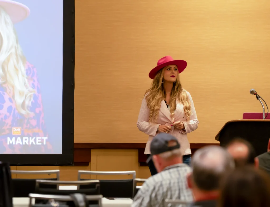 Stefanie Couch presenting beside the screen at the Do it Best LBM Millwork Academy