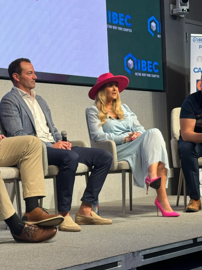 Stefanie Couch asking a question on the AI panel at IIBEC Metro New York