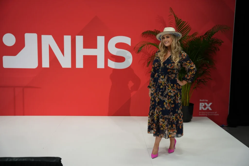 Stefanie Couch on the red NHS stage at the National Hardware Show 2025, where she co-hosted the How Women Rise in Hardware program