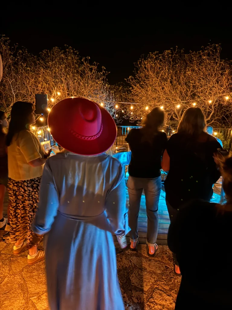 Stefanie Couch at an evening event under string lights at the Nation’s Best Women’s Leadership Retreat