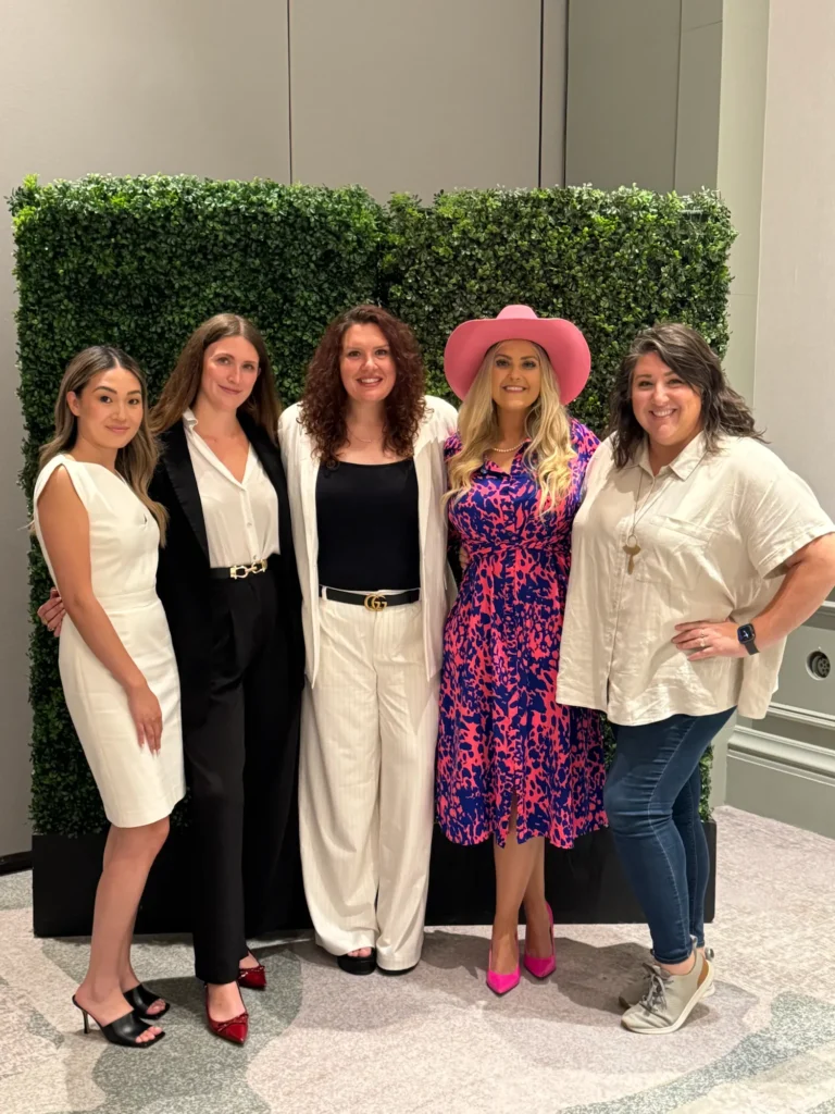 Stefanie Couch with a group of women at the Independent Home Improvement Conference 2025