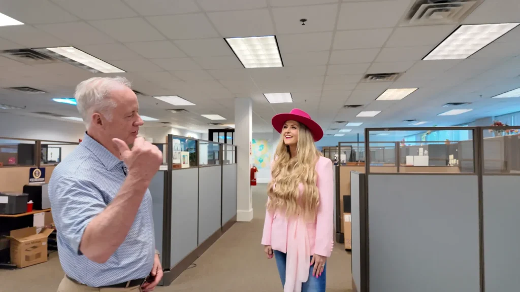 Stefanie Couch talking with a guest in the Magbee office