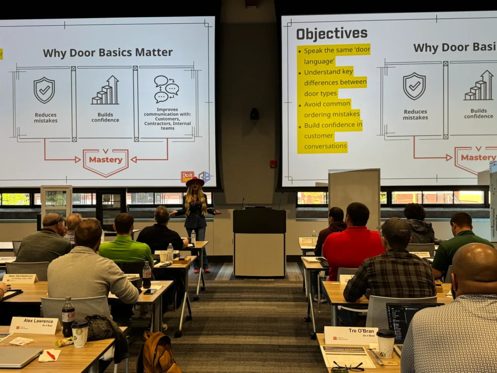 A Millwork Academy classroom at Do it Best headquarters, the Why Door Basics Matter slide on screen