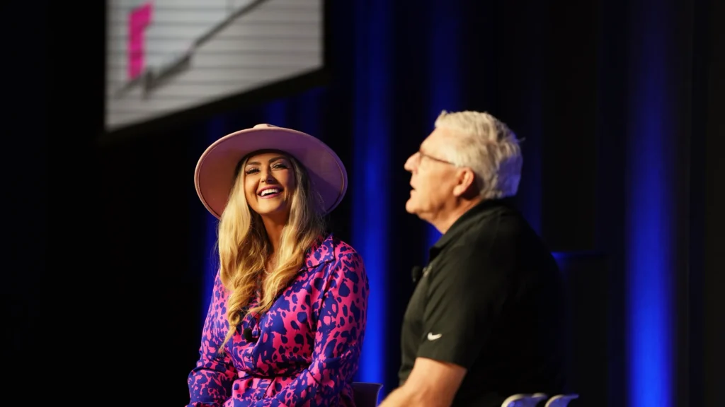 Stefanie Couch laughing with Scott Morrison of Do it Best during her on-stage interview at Do it Best Fall Market 2025