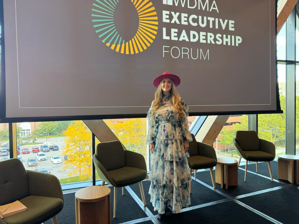 Stefanie Couch, co-facilitator of the WDMA Executive Leadership Forum 2026, in front of the forum screen